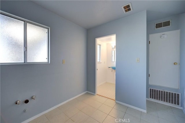 interior space with light tile patterned floors