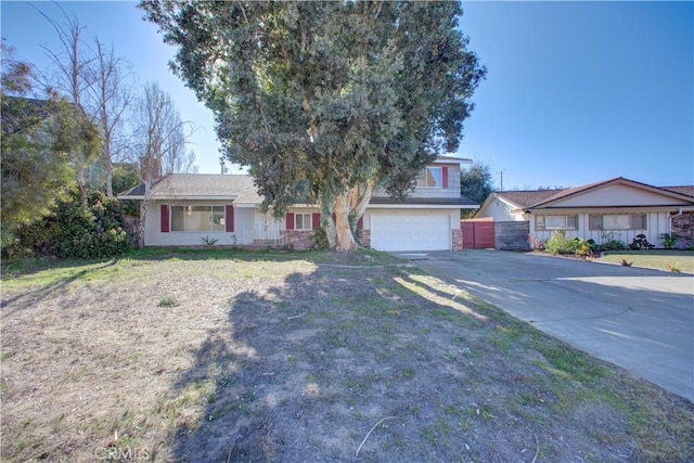 ranch-style home with a front yard and a garage