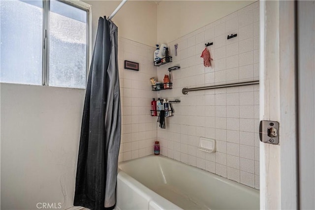 bathroom with shower / bath combo