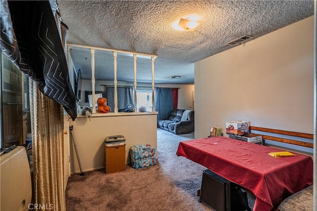 interior space featuring a textured ceiling and pool table