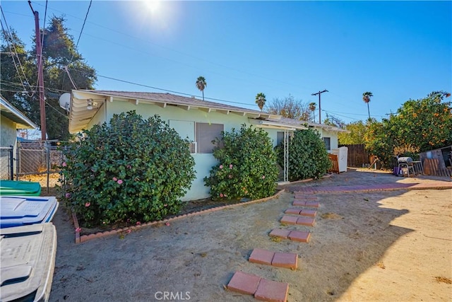 view of side of home with a patio