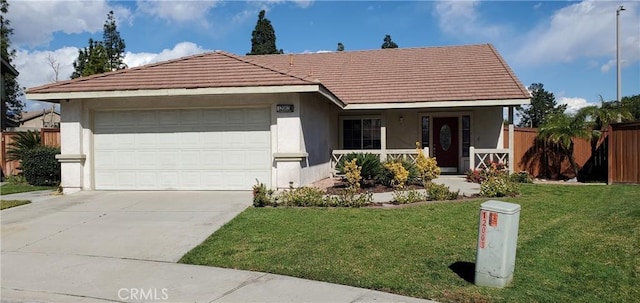 ranch-style house featuring a front lawn and a garage