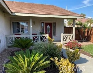 doorway to property featuring covered porch