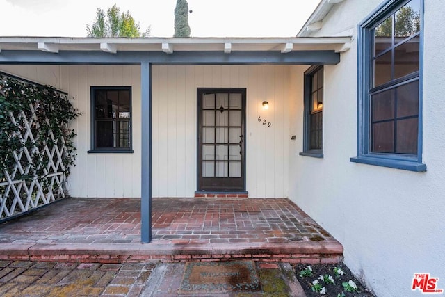 doorway to property with a porch