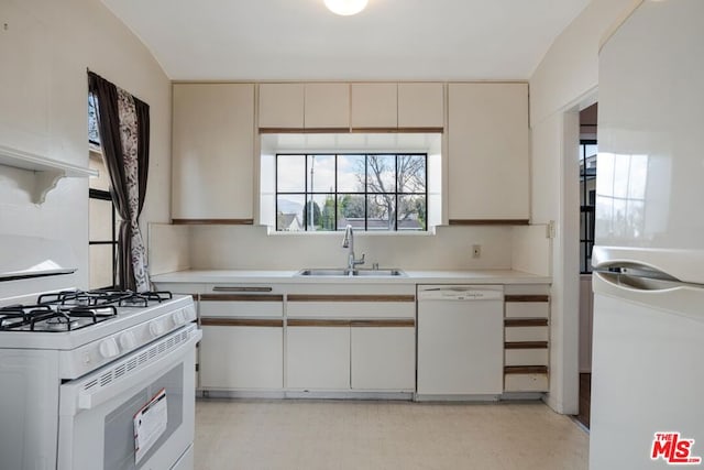 kitchen featuring sink and white appliances