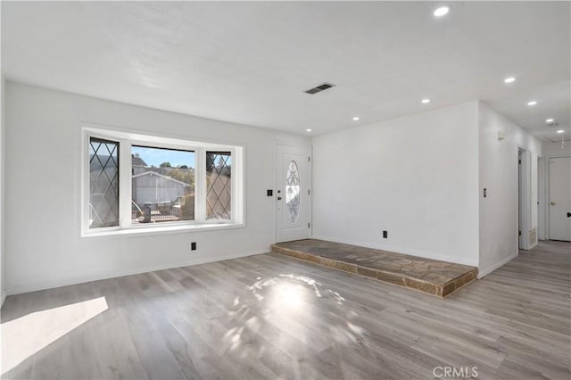 spare room with light hardwood / wood-style flooring