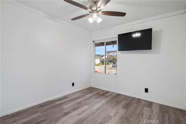 unfurnished room with ceiling fan, hardwood / wood-style floors, and crown molding