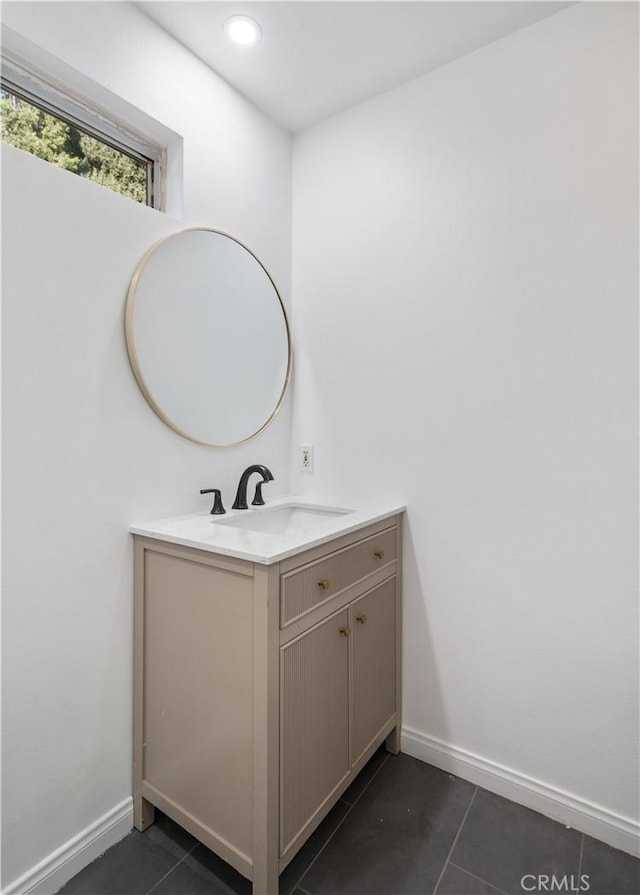 bathroom featuring vanity and tile patterned flooring