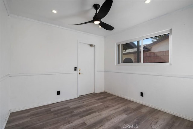 empty room with ceiling fan, ornamental molding, and hardwood / wood-style flooring