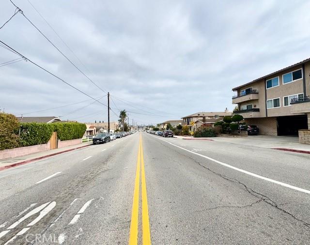 view of road featuring curbs, sidewalks, and a residential view