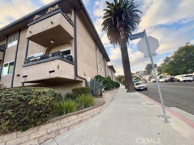 view of side of home featuring stucco siding