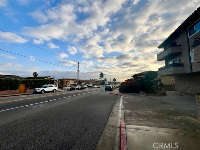 view of road with curbs and sidewalks