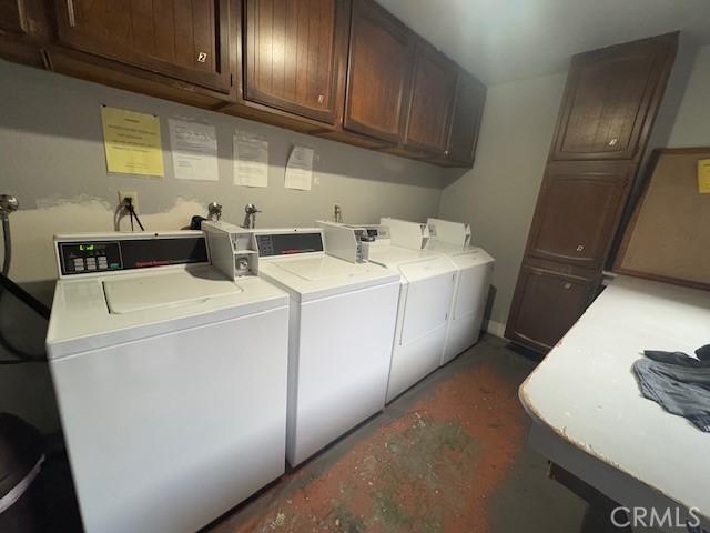 washroom with cabinets and separate washer and dryer