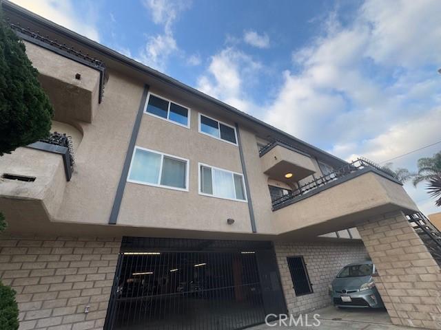 785 W 19th St Unit 12B, San Pedro, CA 90731 - view of building exterior featuring a fenced front yard