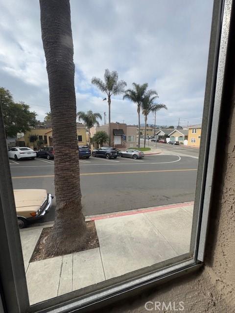 view of road with curbs, sidewalks, and a residential view