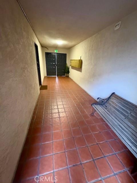 785 W 19th St Unit 12B, San Pedro, CA 90731 - corridor with tile patterned floors and a textured wall