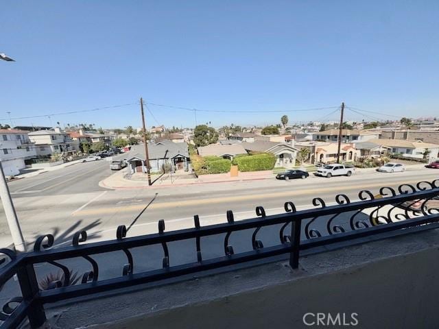 exterior space featuring sidewalks, street lighting, a residential view, and curbs