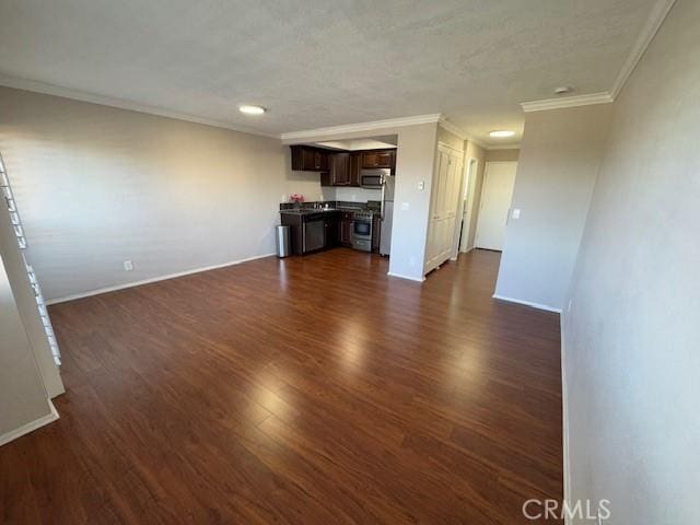 unfurnished living room featuring ornamental molding, dark wood-style flooring, and baseboards