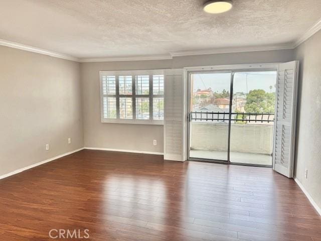 785 W 19th St Unit 12B, San Pedro, CA 90731 - empty room featuring wood finished floors, a textured ceiling, and crown molding