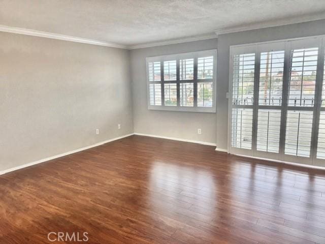 785 W 19th St Unit 12B, San Pedro, CA 90731 - unfurnished room with ornamental molding, dark wood-type flooring, and a textured ceiling