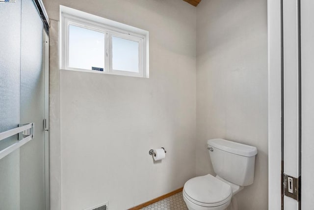 bathroom featuring toilet