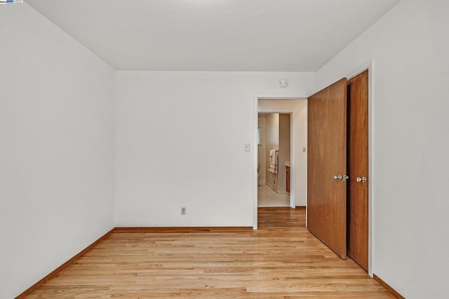 spare room featuring light hardwood / wood-style floors