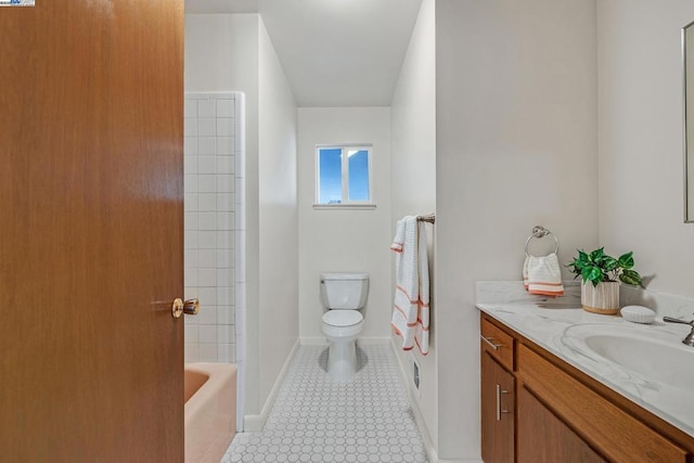 bathroom featuring toilet, vanity, and tile patterned flooring