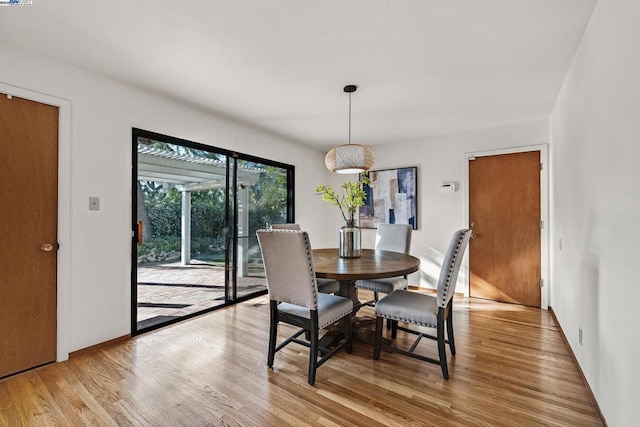 dining room featuring light wood-type flooring