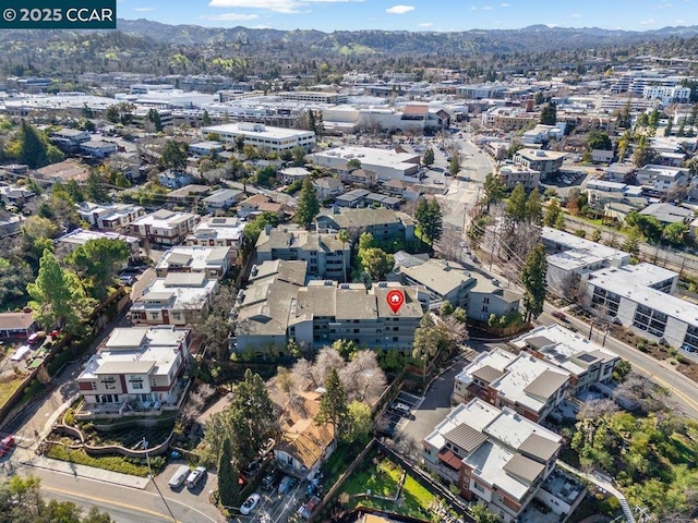 birds eye view of property featuring a mountain view