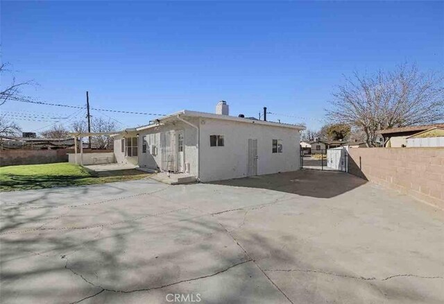 rear view of house featuring a patio area