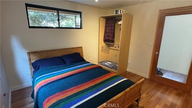 bedroom with wood-type flooring