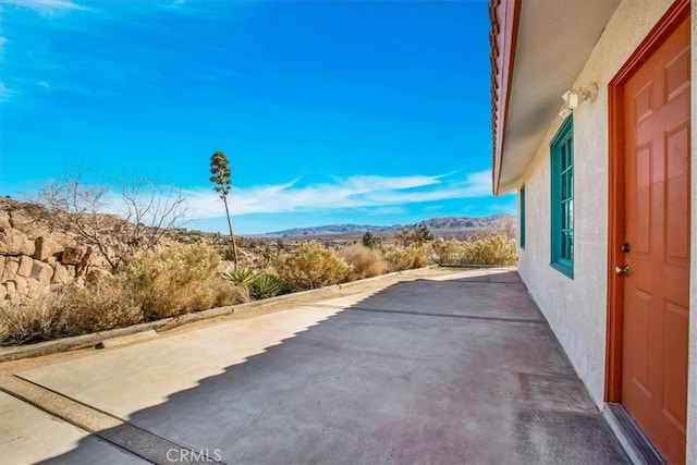 view of patio featuring a mountain view