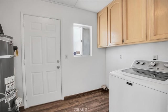 laundry area with washer / dryer, strapped water heater, and cabinets