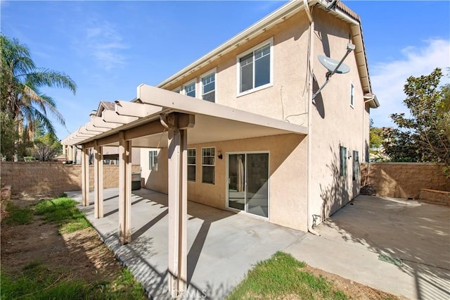 rear view of house featuring a patio