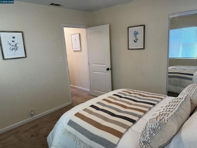 bedroom with dark carpet