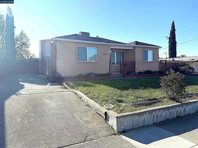 view of front of property with a front lawn