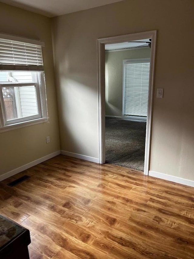 spare room with light hardwood / wood-style flooring