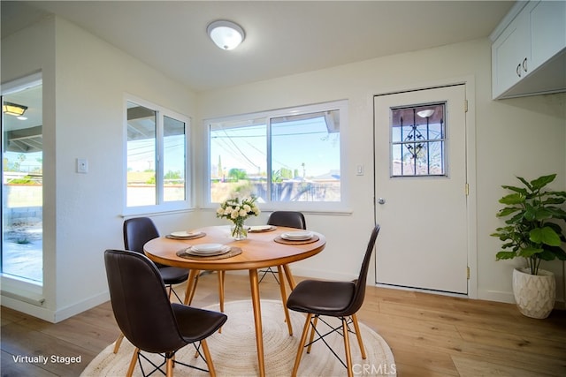 dining area with light hardwood / wood-style flooring