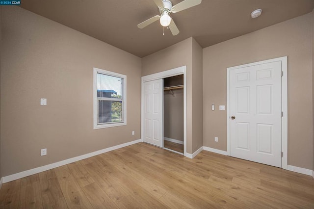 unfurnished bedroom featuring ceiling fan, a closet, and light hardwood / wood-style floors