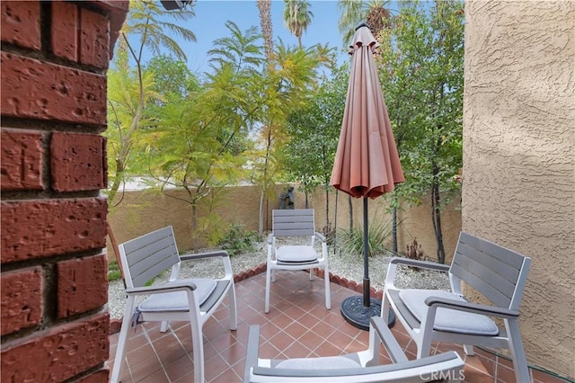 view of patio / terrace featuring fence