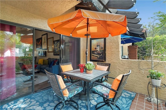 view of patio featuring a balcony