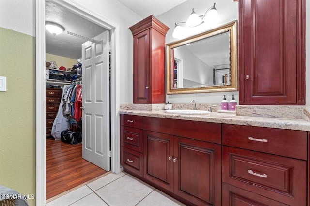 bathroom with tile patterned floors and vanity