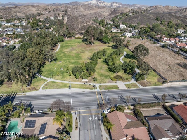 birds eye view of property featuring a mountain view