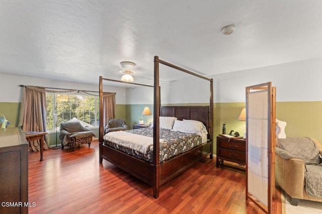 bedroom with ceiling fan and wood-type flooring