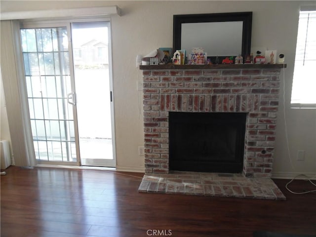 interior details featuring hardwood / wood-style floors and a fireplace