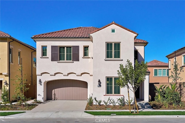 mediterranean / spanish-style home featuring a garage