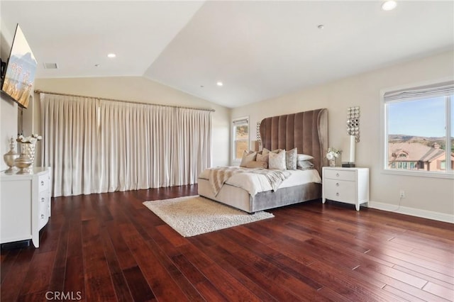 unfurnished bedroom featuring lofted ceiling and dark hardwood / wood-style floors