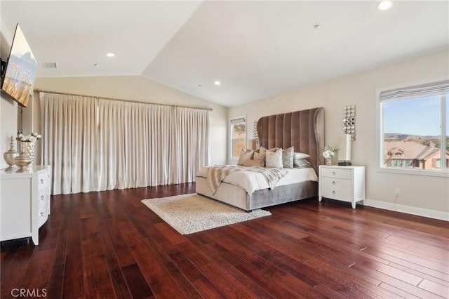 unfurnished bedroom featuring lofted ceiling, recessed lighting, visible vents, hardwood / wood-style floors, and baseboards