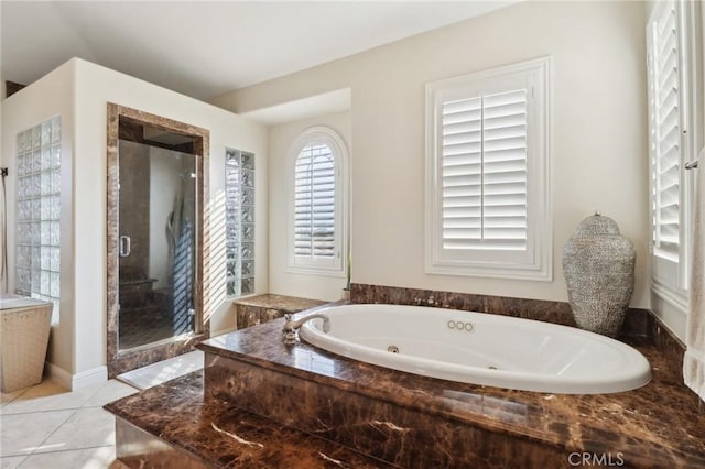 bathroom featuring tile patterned flooring and plus walk in shower