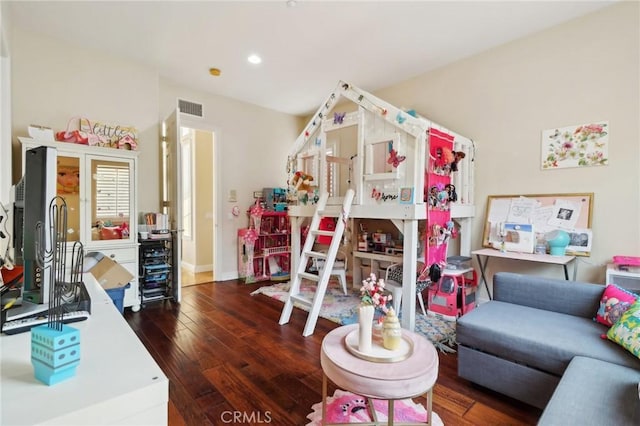 interior space featuring recessed lighting, baseboards, visible vents, and hardwood / wood-style floors